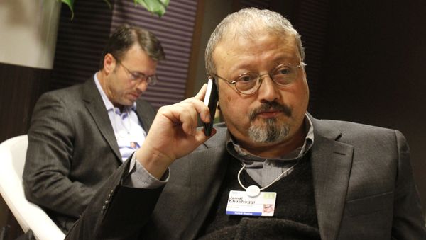 FILE - In this Jan. 29, 2011 file photo, Saudi journalist Jamal Khashoggi speaks on his cellphone at the World Economic Forum in Davos, Switzerland. Khashoggi was a Saudi insider FILE - In this Jan. 29, 2011 file photo, Saudi journalist Jamal Khashoggi speaks on his cellphone at the World Economic Forum in Davos, Switzerland. Khashoggi was a Saudi insider - Sputnik International