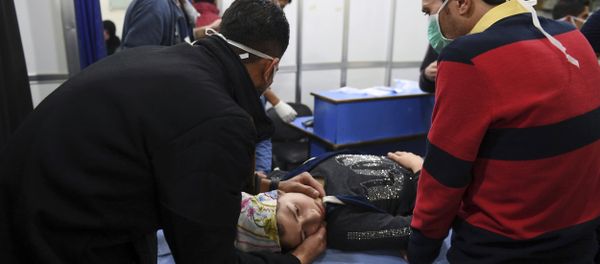 In this photo released by the Syrian official news agency SANA, a woman receives treatment at a hospital following a suspected poison gas attack on her town of al-Khalidiya, in Aleppo, Syria, Saturday, Nov. 24, 2018. In this photo released by the Syrian official news agency SANA, a woman receives treatment at a hospital following a suspected poison gas attack on her town of al-Khalidiya, in Aleppo, Syria, Saturday, Nov. 24, 2018. - Sputnik International