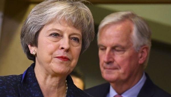 British Prime Minister Theresa May, left, walks ahead of European Union chief Brexit negotiator Michel Barnier prior to a meeting with European Commission President Jean-Claude Juncker at EU headquarters in Brussels, Saturday, Nov. 24, 2018 British Prime Minister Theresa May, left, walks ahead of European Union chief Brexit negotiator Michel Barnier prior to a meeting with European Commission President Jean-Claude Juncker at EU headquarters in Brussels, Saturday, Nov. 24, 2018 - Sputnik International