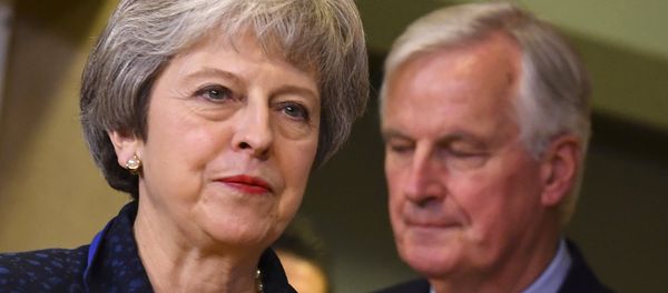 British Prime Minister Theresa May, left, walks ahead of European Union chief Brexit negotiator Michel Barnier prior to a meeting with European Commission President Jean-Claude Juncker at EU headquarters in Brussels, Saturday, Nov. 24, 2018 - Sputnik International