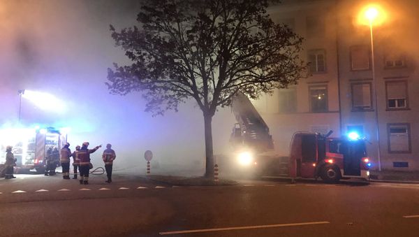 Firefighters are seen in front of a house where six people were killed in an apartment fire early on Monday morning, police said, while an unspecified number of others caught in the blaze were taken to the hospital in Solothurn, Switzerland November 26, 2018 - Sputnik International