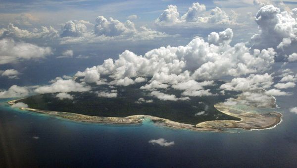 In this Nov. 14, 2005 file photo, clouds hang over the North Sentinel Island, in India's southeastern Andaman and Nicobar Islands. An American is believed to have been killed by an isolated Indian island tribe known to fire at outsiders with bows and arrows, Indian police said Wednesday, Nov. 21, 2018. - Sputnik International