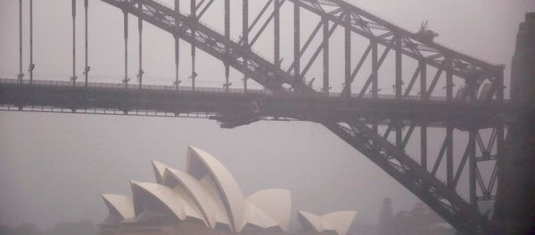 A boat passes under the Sydney Harbour Bridge and in front of the Sydney Opera House as strong winds and heavy rain hit the city of Sydney, Australia, November 28, 2018 A boat passes under the Sydney Harbour Bridge and in front of the Sydney Opera House as strong winds and heavy rain hit the city of Sydney, Australia, November 28, 2018 - Sputnik International