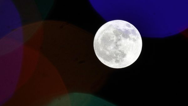 The full moon rises behind holiday lights on Thanksgiving in Lawrence, Kansas, US, Thursday, 22 November 2018. - Sputnik International
