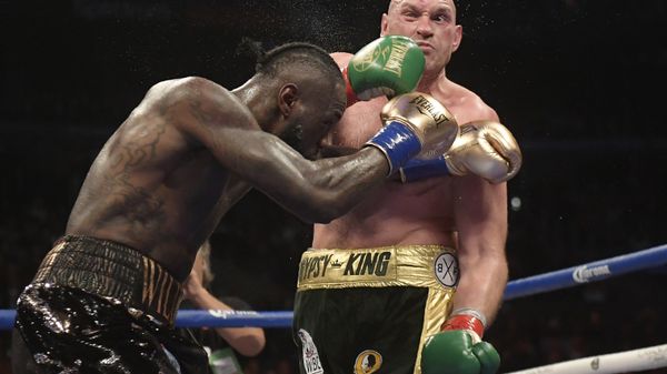Deontay Wilder, left, connects with Tyson Fury, of England, during a WBC heavyweight championship boxing match Saturday, Dec. 1, 2018, in Los Angeles - Sputnik International
