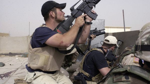 plainclothes contractors working for Blackwater USA take part in a firefight as Iraqi demonstrators loyal to Muqtada al-Sadr attempt to advance on a facility being defended by U.S. and Spanish soldiers in the Iraqi city of Najaf plainclothes contractors working for Blackwater USA take part in a firefight as Iraqi demonstrators loyal to Muqtada al-Sadr attempt to advance on a facility being defended by U.S. and Spanish soldiers in the Iraqi city of Najaf - Sputnik International