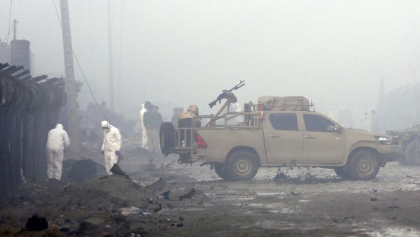 Security forces inspect the site of a suicide bomb attack in Kabul, Afghanistan, Thursday, Nov. 29, 2018. Taliban insurgents staged a coordinated attack targeting a security firm in the Afghan capital on Wednesday, killing people and wounding others. - Sputnik International