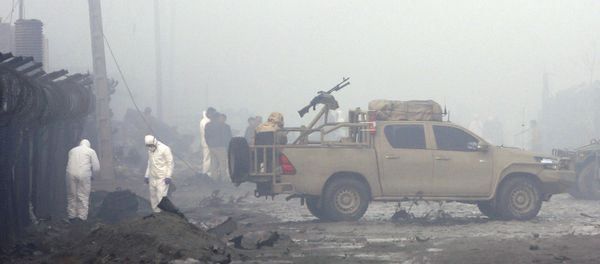 Security forces inspect the site of a suicide bomb attack in Kabul, Afghanistan, Thursday, Nov. 29, 2018. Taliban insurgents staged a coordinated attack targeting a security firm in the Afghan capital on Wednesday, killing people and wounding others. - Sputnik International
