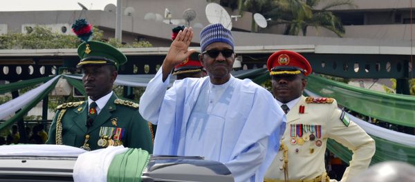 Nigerian President, Muhammadu Buhari, waves to the crowd during the 58th anniversary celebrations of Nigerian independence, in Abuja, Nigeria, Monday, Oct. 1, 2018 - Sputnik International