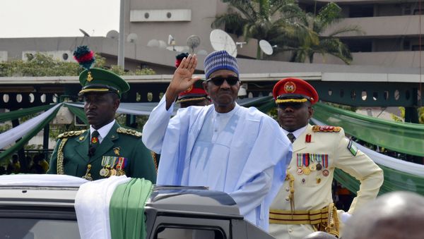 Nigerian President, Muhammadu Buhari, waves to the crowd during the 58th anniversary celebrations of Nigerian independence, in Abuja, Nigeria, Monday, Oct. 1, 2018 - Sputnik International