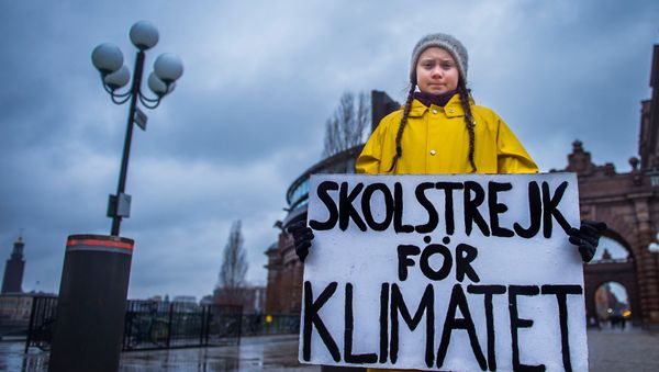 15-year-old Swedish girl Greta Thunberg holds a placard reading School strike for the climate during a manifestation against climate change outside the Swedish parliament in Stockholm, Sweden November 30, 2018 15-year-old Swedish girl Greta Thunberg holds a placard reading School strike for the climate during a manifestation against climate change outside the Swedish parliament in Stockholm, Sweden November 30, 2018 - Sputnik International