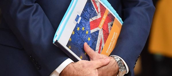 European Union flag and UK flag are seen on the front page of document reading article 50 - European Council before the special meeting of the European Council to endorse the draft Brexit withdrawal agreement and to approve the draft political declaration on future EU-UK relations on November 25, 2018 in Brussels European Union flag and UK flag are seen on the front page of document reading article 50 - European Council before the special meeting of the European Council to endorse the draft Brexit withdrawal agreement and to approve the draft political declaration on future EU-UK relations on November 25, 2018 in Brussels - Sputnik International