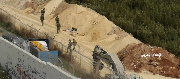 In this photo released by Hezbollah Central Military Media, Israeli military digger work on the Lebanese-Israeli border next to a wall that was built by Israel in the southern village of Kafr Kila, Lebanon on Tuesday, Dec. 4, 2018. In this photo released by Hezbollah Central Military Media, Israeli military digger work on the Lebanese-Israeli border next to a wall that was built by Israel in the southern village of Kafr Kila, Lebanon on Tuesday, Dec. 4, 2018. - Sputnik International