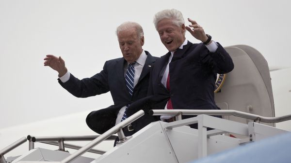 Vice President Joe Biden, left, accompanied by former President Bill Clinton walk carefully off Air Force Two during a rainstorm,, upon their arrival in Youngstown, Ohio, for a campaign stop, Monday, Oct. 29, 2012. Vice President Joe Biden, left, accompanied by former President Bill Clinton walk carefully off Air Force Two during a rainstorm,, upon their arrival in Youngstown, Ohio, for a campaign stop, Monday, Oct. 29, 2012. - Sputnik International
