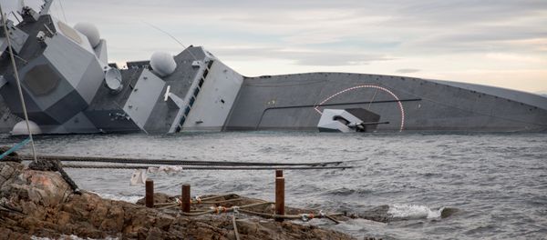 A shipwrecked Norwegian navy frigate KNM Helge Ingstad is seen in this Norwegian Coastal Administration handout picture in Oygarden, Norway, November 13, 2018 A shipwrecked Norwegian navy frigate KNM Helge Ingstad is seen in this Norwegian Coastal Administration handout picture in Oygarden, Norway, November 13, 2018 - Sputnik International