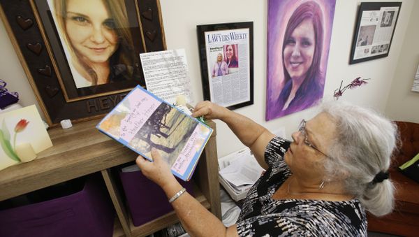 In this Monday, Aug. 6, 2018 photo, Susan Bro, mother of Heather Heyer, who was killed during the Unite the Right rally last year, looks over memorabilia in her office in Charlottesville, Va - Sputnik International