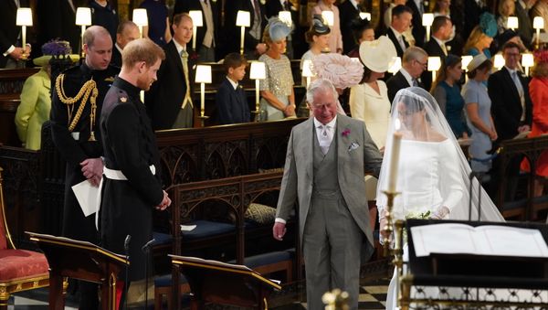 Britain's Prince Harry looks at his bride, Meghan Markle, as she arrives accompanied by the Prince Charles during the wedding ceremony of Prince Harry and Meghan Markle at St. George's Chapel in Windsor Castle in Windsor, near London, England, Saturday, May 19, 2018 - Sputnik International