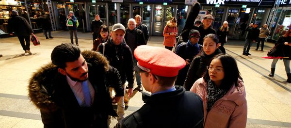 Commuters line up in front of an information counter of Deutsche Bahn during a rail workers' strike across the country due to a pay dispute with Deutsche Bahn, in Cologne, Germany December 10, 2018 - Sputnik International