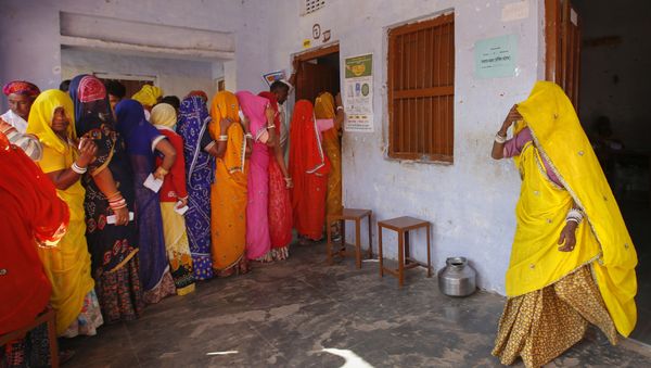 Indian women wait in a queue to cast their votes in village Padampura, near Ajmer, India, Friday, Dec. 7, 2018 Indian women wait in a queue to cast their votes in village Padampura, near Ajmer, India, Friday, Dec. 7, 2018 - Sputnik International