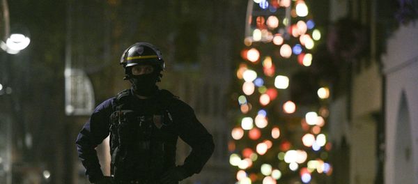 A policeman patrols in the rue des Grandes Arcades in Strasbourg, eastern France, after a shooting breakout, on December 11, 2018. A policeman patrols in the rue des Grandes Arcades in Strasbourg, eastern France, after a shooting breakout, on December 11, 2018. - Sputnik International