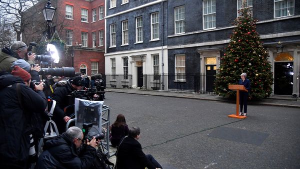 Britain's Prime Minister Theresa May addresses the media outside 10 Downing Street after it was announced that the Conservative Party will hold a vote of no confidence in her leadership, in London, Britain, December 12, 2018 Britain's Prime Minister Theresa May addresses the media outside 10 Downing Street after it was announced that the Conservative Party will hold a vote of no confidence in her leadership, in London, Britain, December 12, 2018 - Sputnik International