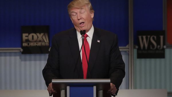 Republican presidential candidate Donald Trump reacts to Carly Fiorina during the Republican Presidential Debate hosted by Fox Business and The Wall Street Journal November 10, 2015 in Milwaukee, Wisconsin - Sputnik International