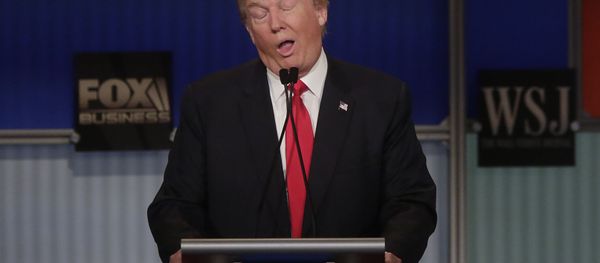 Republican presidential candidate Donald Trump reacts to Carly Fiorina during the Republican Presidential Debate hosted by Fox Business and The Wall Street Journal November 10, 2015 in Milwaukee, Wisconsin Republican presidential candidate Donald Trump reacts to Carly Fiorina during the Republican Presidential Debate hosted by Fox Business and The Wall Street Journal November 10, 2015 in Milwaukee, Wisconsin - Sputnik International