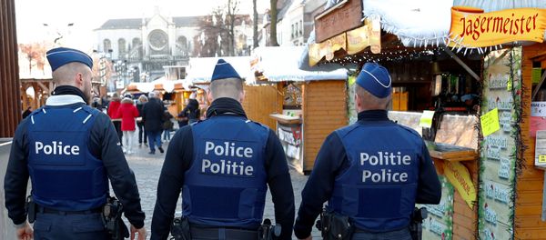Belgian police officers patrol the area of Christmas market in central Brussels, Belgium, December 12, 2018 Belgian police officers patrol the area of Christmas market in central Brussels, Belgium, December 12, 2018 - Sputnik International