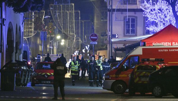Policemen and emergency medical response vehicules are seen in the rue des Grandes Arcades in Strasbourg, eastern France, after a shooting breakout, on December 11, 2018. - Sputnik International