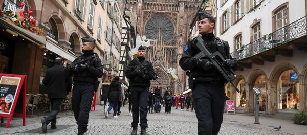 French policemen patrol during the reopening of the christmas market of Strasbourg, eastern France, on December 14, 2018 as the author of the attack was killed on December 13, 2018. - Sputnik International