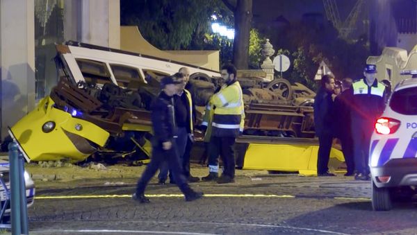 In this image taken from video, emergency service personnel work at the scene of a tram accident, Friday, Dec. 14, 2018, in Lisbon, Portugal. - Sputnik International