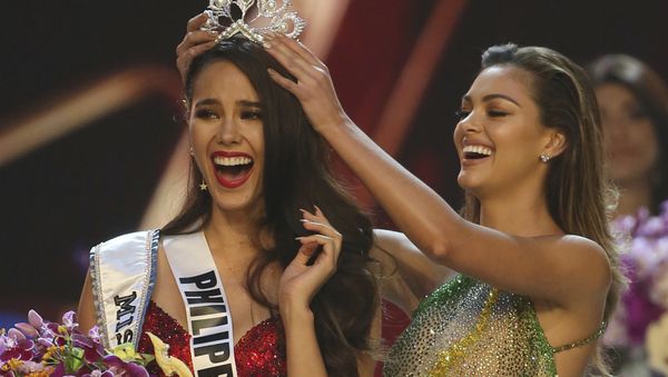 Catriona Gray of the Philippines, left, reacts as she is crowned the new Miss Universe 2018 by Miss Universe 2017 Demi-Leigh Nel-Peters during the final round of the 67th Miss Universe competition in Bangkok, Thailand, Monday, Dec. 17, 2018. Catriona Gray of the Philippines, left, reacts as she is crowned the new Miss Universe 2018 by Miss Universe 2017 Demi-Leigh Nel-Peters during the final round of the 67th Miss Universe competition in Bangkok, Thailand, Monday, Dec. 17, 2018. - Sputnik International