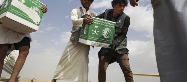 In this Saturday, Feb. 3, 2018 photograph, relief workers unload aid carried into Yemen by the Saudi military in Marib, Yemen In this Saturday, Feb. 3, 2018 photograph, relief workers unload aid carried into Yemen by the Saudi military in Marib, Yemen - Sputnik International