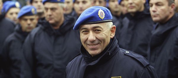 In this photo taken Oct. 24, 2003, former Police Gen. Goran Radosavljevic Guri stands in front of Serbia's elite police troops during a protest in downtown Belgrade, Serbia. In this photo taken Oct. 24, 2003, former Police Gen. Goran Radosavljevic Guri stands in front of Serbia's elite police troops during a protest in downtown Belgrade, Serbia. - Sputnik International