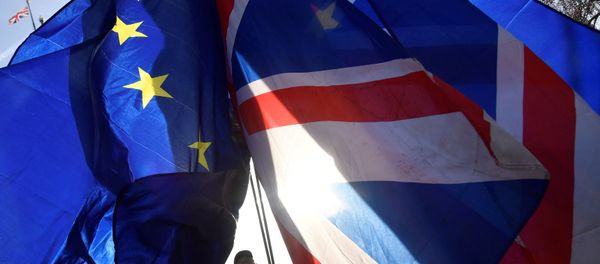 Demonstrators hold EU and Union flags during an anti-Brexit protest opposite the Houses of Parliament in London, Britain, December 17, 2018 Demonstrators hold EU and Union flags during an anti-Brexit protest opposite the Houses of Parliament in London, Britain, December 17, 2018 - Sputnik International
