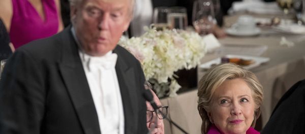 Republican presidential candidate Donald Trump, left, accompanied by Democratic presidential candidate Hillary Clinton, right, speaks at the 71st annual Alfred E. Smith Memorial Foundation Dinner, a charity gala organized by the Archdiocese of New York, Thursday, Oct. 20, 2016, at the Waldorf Astoria hotel in New York - Sputnik International