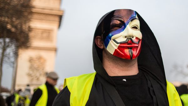 A protester takes part in a demonstration of the yellow vests movement in Paris, France. - Sputnik International