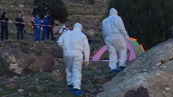 In this photo provided by Moroccan news channel 2M and taken on Tuesday, Dec. 18, 2018, a forensic team is seen at the area where the bodies of two Scandinavian women tourists were found dead, near Imlil in the High Atlas mountains, Morocco In this photo provided by Moroccan news channel 2M and taken on Tuesday, Dec. 18, 2018, a forensic team is seen at the area where the bodies of two Scandinavian women tourists were found dead, near Imlil in the High Atlas mountains, Morocco - Sputnik International