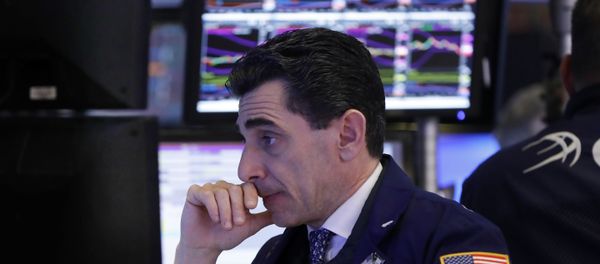 In this Dec. 6, 2018, specialist Peter Mazza works at his post on the floor of the New York Stock Exchange. In this Dec. 6, 2018, specialist Peter Mazza works at his post on the floor of the New York Stock Exchange. - Sputnik International