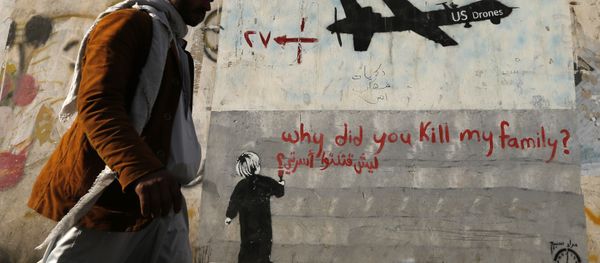 A man walks past a graffiti, denouncing strikes by U.S. drones in Yemen, painted on a wall in Sanaa, Yemen on November 13, 2014 A man walks past a graffiti, denouncing strikes by U.S. drones in Yemen, painted on a wall in Sanaa, Yemen on November 13, 2014 - Sputnik International