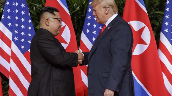 U.S. President Donald Trump shakes hands with North Korea leader Kim Jong Un at the Capella resort on Sentosa Island Tuesday, June 12, 2018 in Singapore. U.S. President Donald Trump shakes hands with North Korea leader Kim Jong Un at the Capella resort on Sentosa Island Tuesday, June 12, 2018 in Singapore. - Sputnik International
