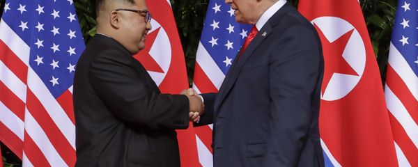 U.S. President Donald Trump shakes hands with North Korea leader Kim Jong Un at the Capella resort on Sentosa Island Tuesday, June 12, 2018 in Singapore. U.S. President Donald Trump shakes hands with North Korea leader Kim Jong Un at the Capella resort on Sentosa Island Tuesday, June 12, 2018 in Singapore. - Sputnik International