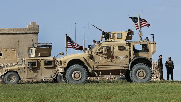 In this picture taken on Thursday, March 29, 2018, a fighter, second from right, of U.S-backed Syrian Manbij Military Council stands next to U.S. humvee at a U.S. troop's outpost on a road leading to the tense front line between Syrian Manbij Military Council fighters and Turkish-backed fighters, at Halawanji village, north of Manbij town, Syria - Sputnik International
