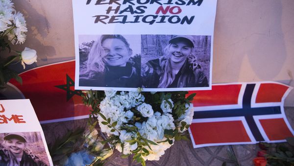 This picture taken on December 21, 2018 shows a combo photo murdered Danish student Louisa Vesterager Jespersen (L) and Nowegian Maren Ueland placed on top of flowers and between the flags of Morocco an Norway as Moroccans pay tribute to the Scandinavian victims - Sputnik International