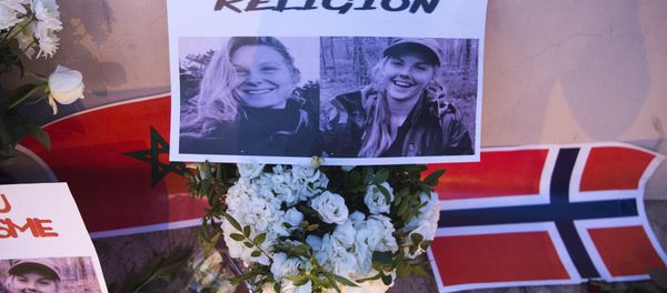 This picture taken on December 21, 2018 shows a combo photo murdered Danish student Louisa Vesterager Jespersen (L) and Nowegian Maren Ueland placed on top of flowers and between the flags of Morocco an Norway as Moroccans pay tribute to the Scandinavian victims This picture taken on December 21, 2018 shows a combo photo murdered Danish student Louisa Vesterager Jespersen (L) and Nowegian Maren Ueland placed on top of flowers and between the flags of Morocco an Norway as Moroccans pay tribute to the Scandinavian victims - Sputnik International