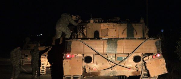 Turkish troops gather around armoured personnel carriers near the rebel-held northern Syrian border town of al-Rai on December 25, 2018 - Sputnik International