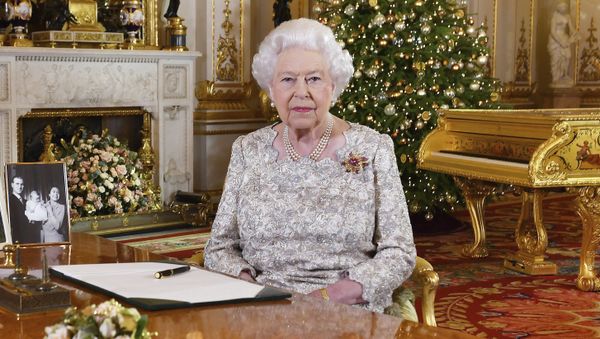 In this photo released on Monday, Dec. 24, 2018, Queen Elizabeth II poses after she recorded her annual Christmas Day message, in the White Drawing Room of Buckingham Palace in central London In this photo released on Monday, Dec. 24, 2018, Queen Elizabeth II poses after she recorded her annual Christmas Day message, in the White Drawing Room of Buckingham Palace in central London - Sputnik International