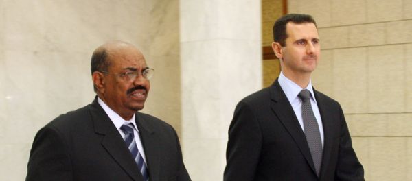 Syrian President Bashar al-Assad (R) meets with Sudanese counterpart Omar Al-Bashir (L) at the presidential palace in Damascus on January 12, 2008 - Sputnik International
