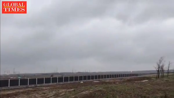 At Tesla's new Gigafactory in Lingang, Shanghai, shows no signs of ongoing construction work. The company signed a land leasing contract with local Shanghai authorities to build the factory on October 17. - Sputnik International