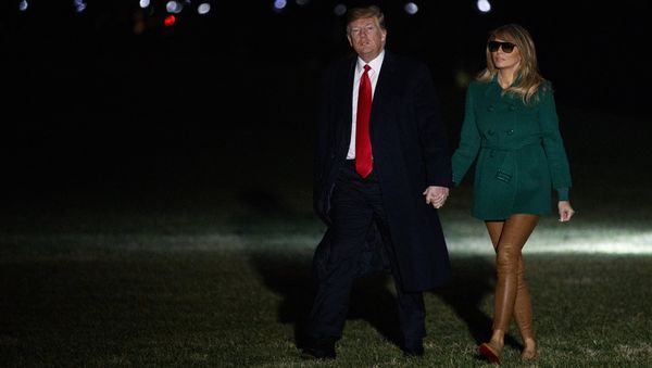 President Donald Trump and first lady Melania Trump arrive on the South Lawn of the White House after making a surprise visit to troops in Iraq, Thursday, Dec. 27, 2018, in Washington - Sputnik International